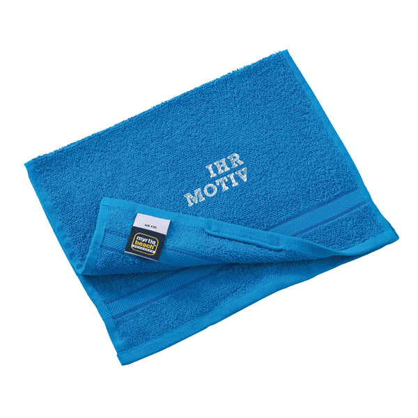 Ihr Motiv gestickt oberhalb der Bordüre des Tuches