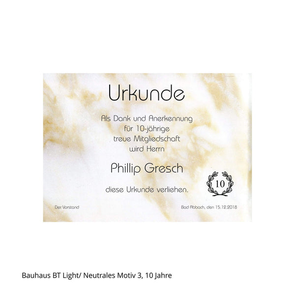 Urkunde mit Jubiläumszahl 10 auf marmoriertem Karton